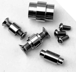 Loose screw assemblies, three small screws and cylindrical hardware from a Para 3 supplier reference