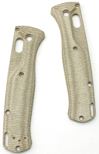 Two tan textured handle scales with circular holes and elongated openings