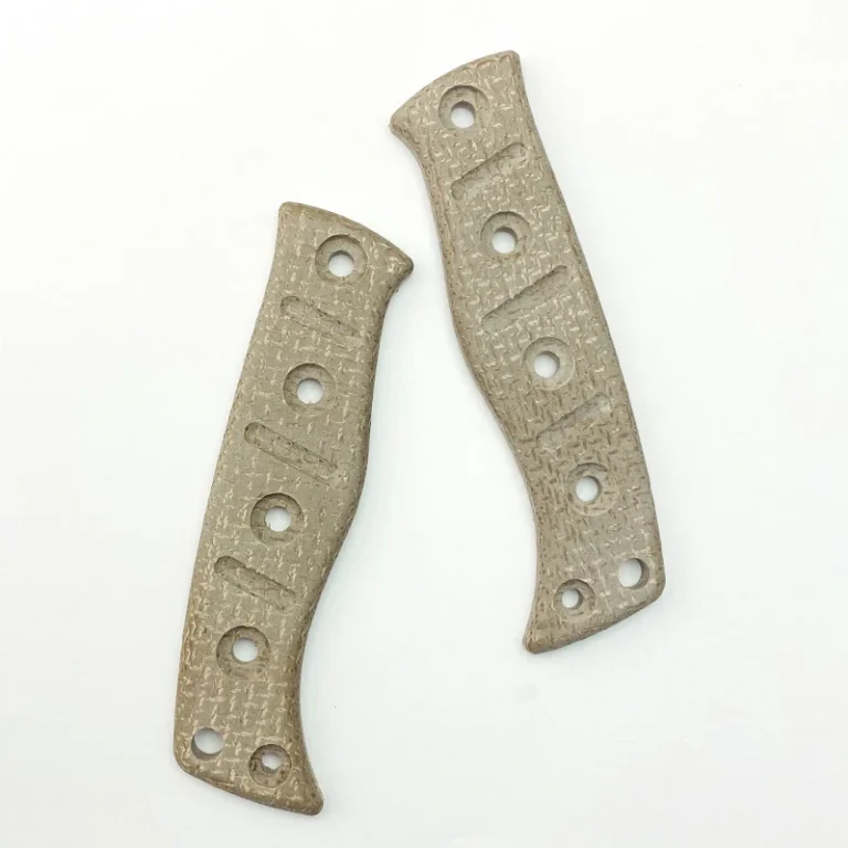 Two tan textured handle scales with elongated grooves and multiple round mounting openings
