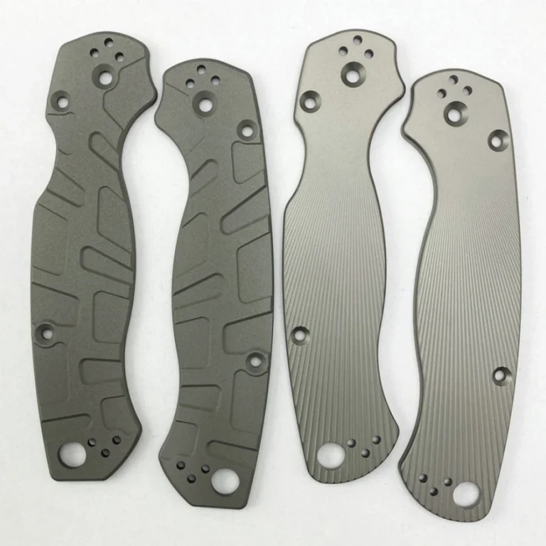 Four gray handle scales showing two surface patterns, geometric grooves and fine parallel grooves