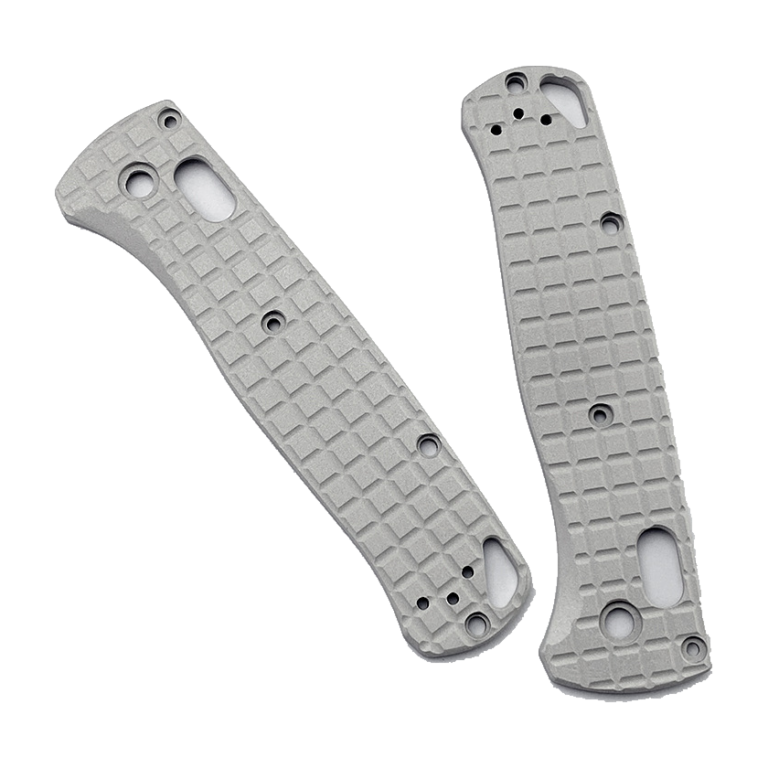 Two gray handle scales with original grid-like relief, round holes and elongated openings