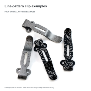 Four black and silver-tone slotted clips with their original line patterns and mounting ears